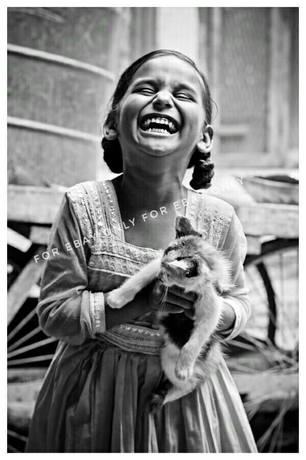 Vintage Photo reprint of a Joyful Child Little Girl Happy to Have a Kitten Cat 