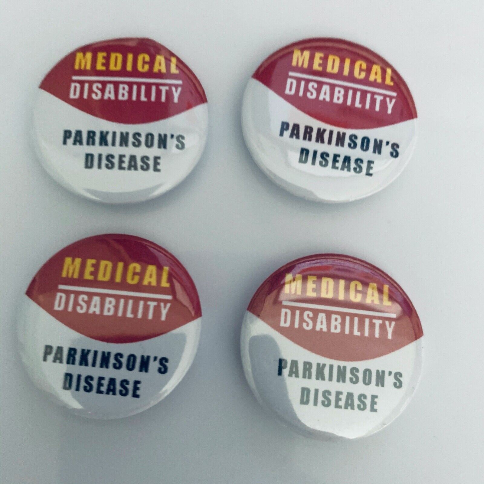 4 x 32mm Parkinson's disease pin badges