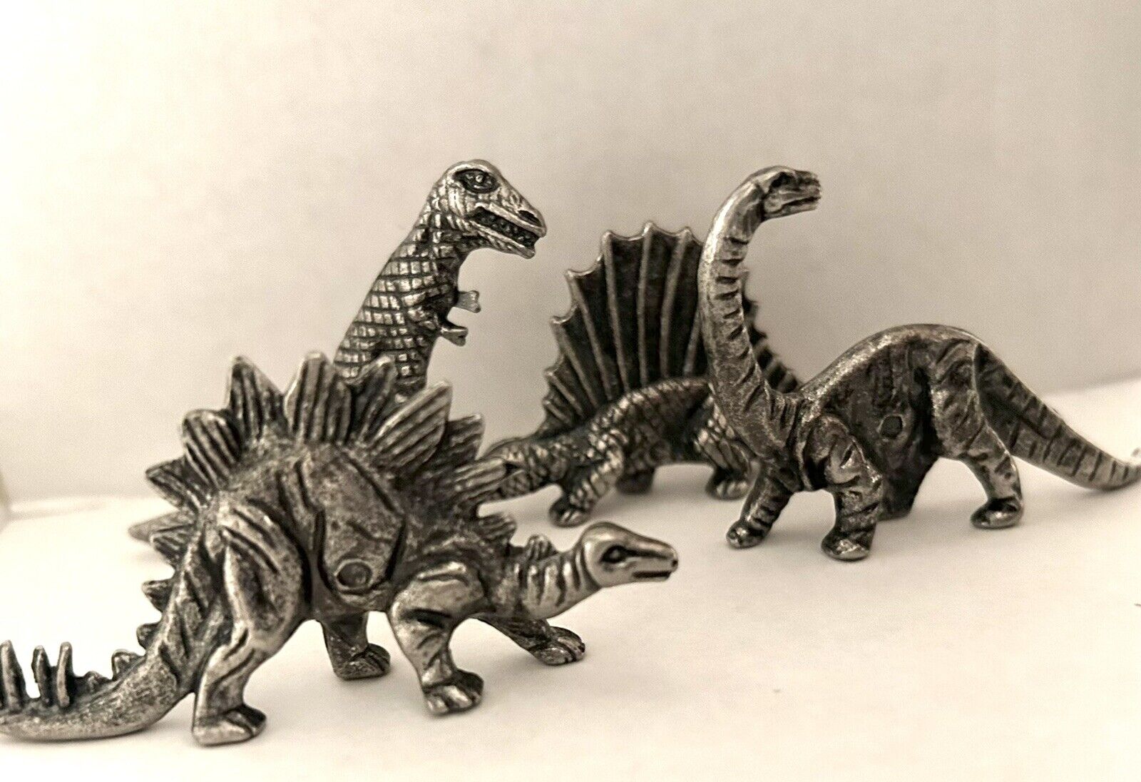 4 Vintage Shiny Silver METAL  DINOSAURS Brontosaurus Stegosaurus T-Rex, Mini