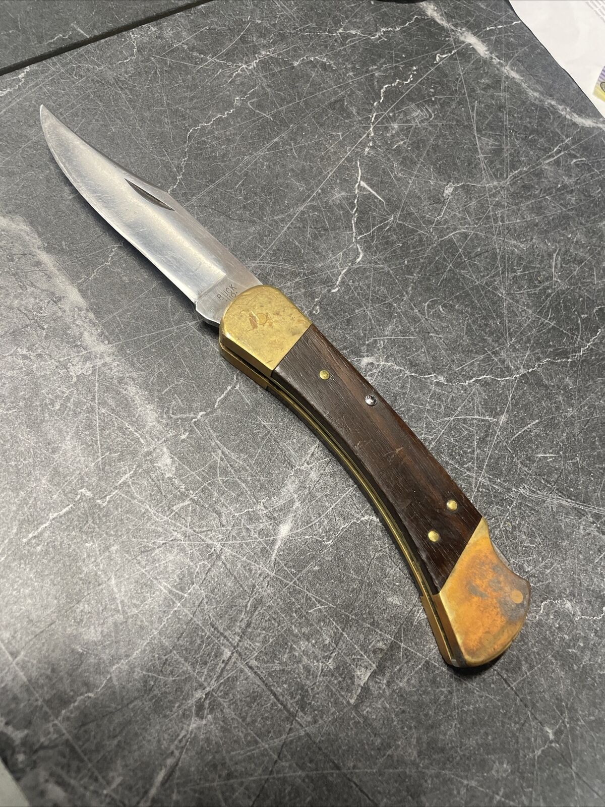 Buck Knife 110/USA Lockback Stainless Steel Walnut/Brass 3 Pin Handle 3.75 Blade