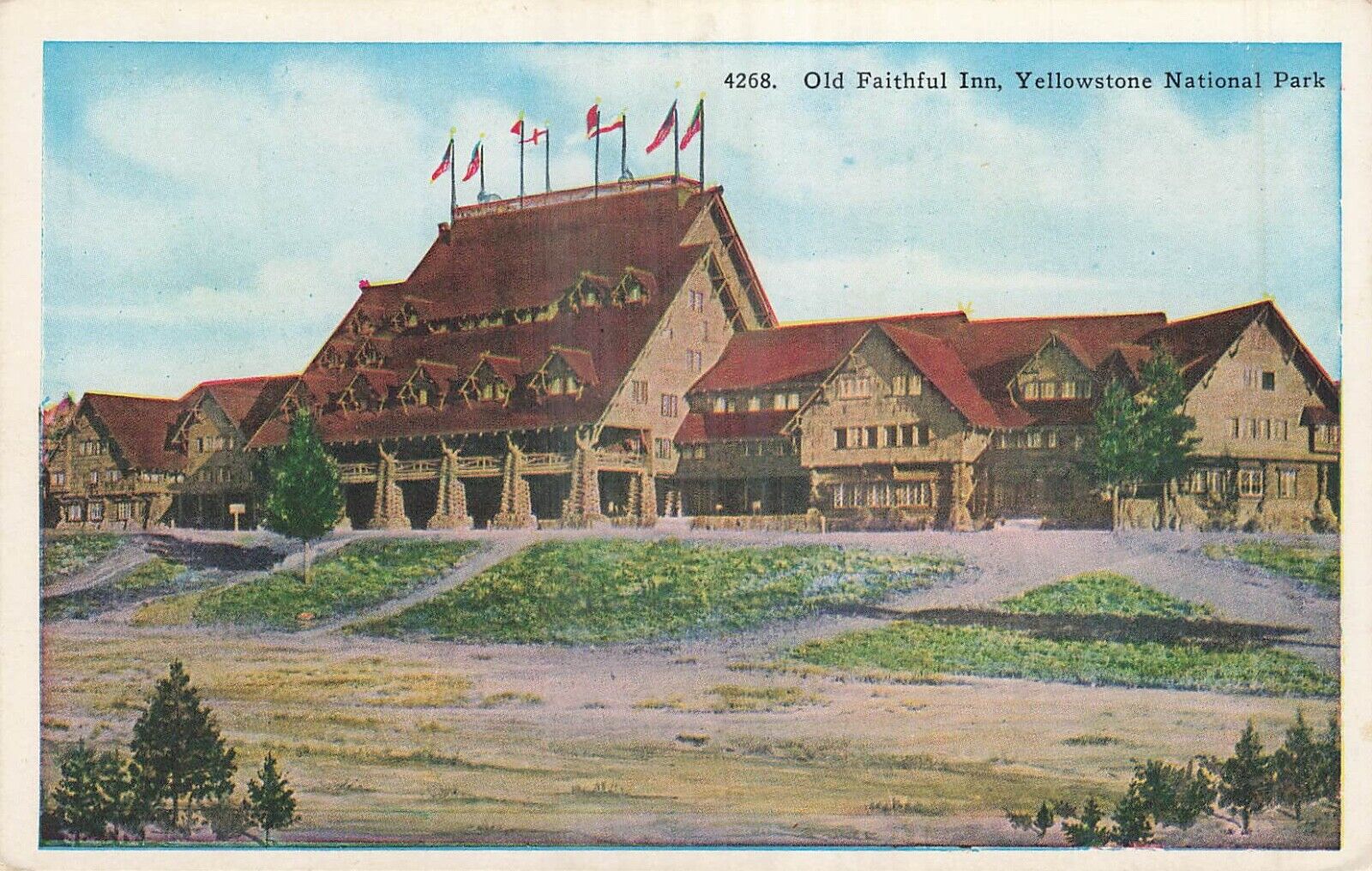 Vintage HHT Co. Postcard Old Faithful Inn Yellowstone National Park USA Flag