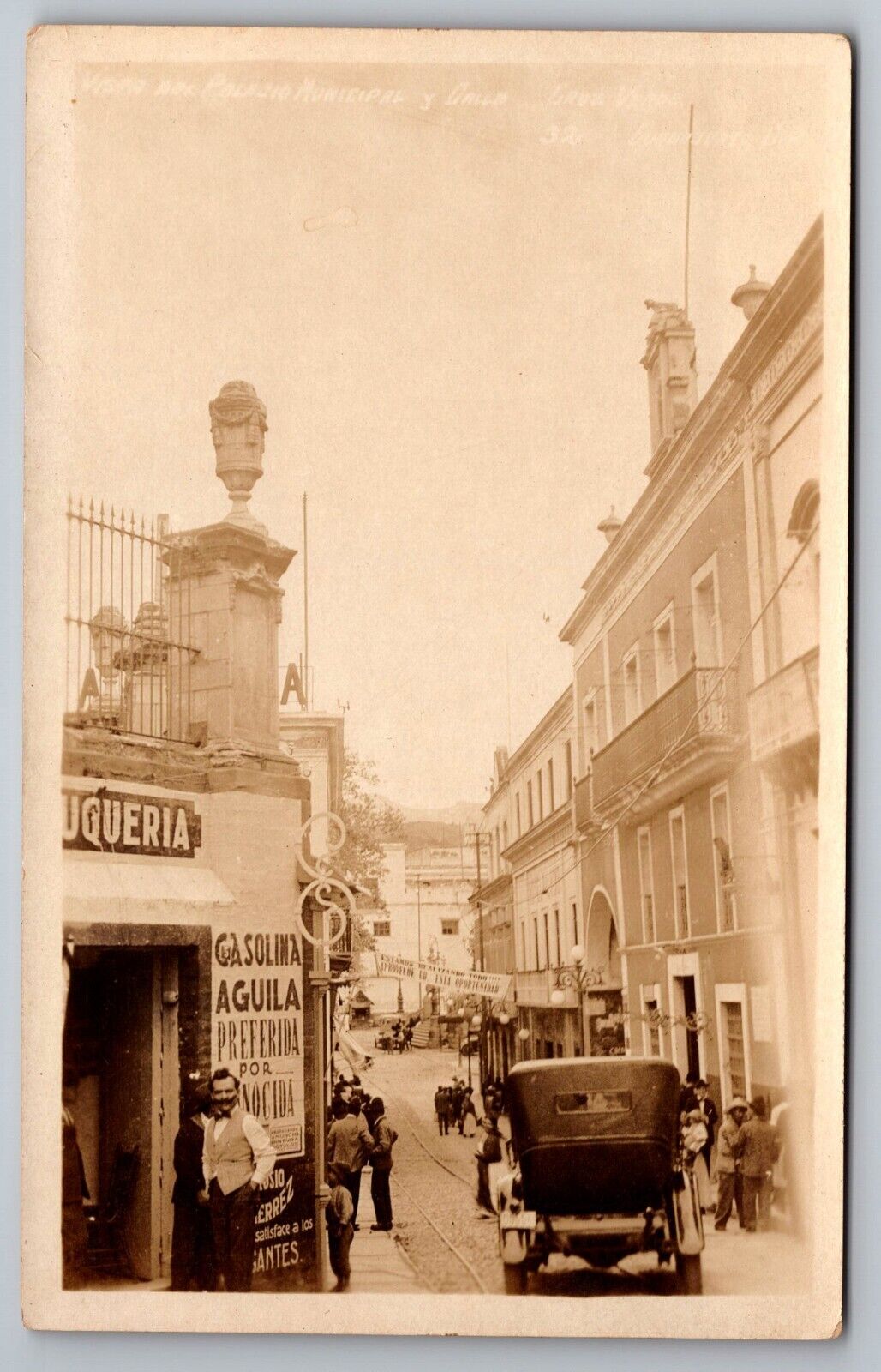 RPPC street scene in Guanajuato Mexico Barber shop, Aguila gasoline, postcard