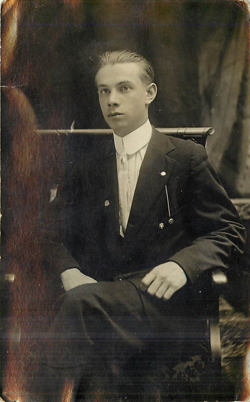 Young Man in Suit Sitting in Chair RPPC c 1915 Postcard