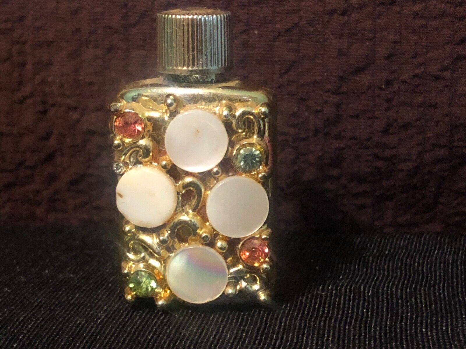 vintage tiny golden color  jewelled perfume bottle
