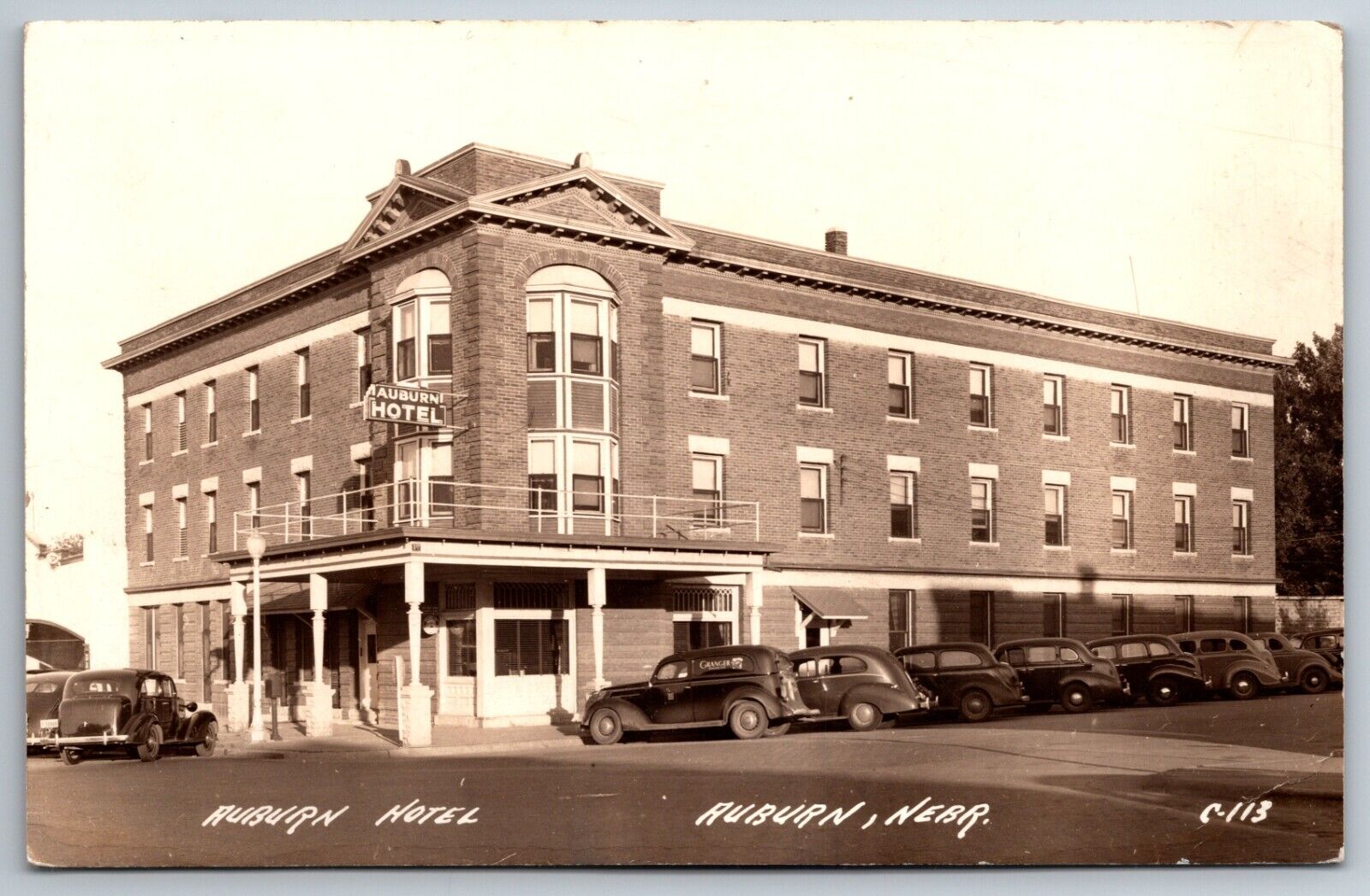Auburn Hotel Nebraska Street View Old Cars Granger Posted 1943 RPPC Postcard