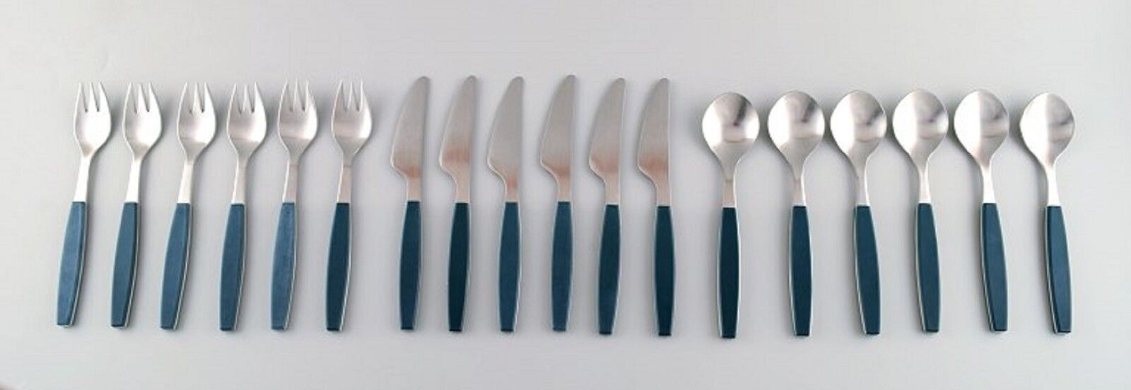 Complete service for 6 p, Henning Koppel. Stainless steel ,green plastic cutlery