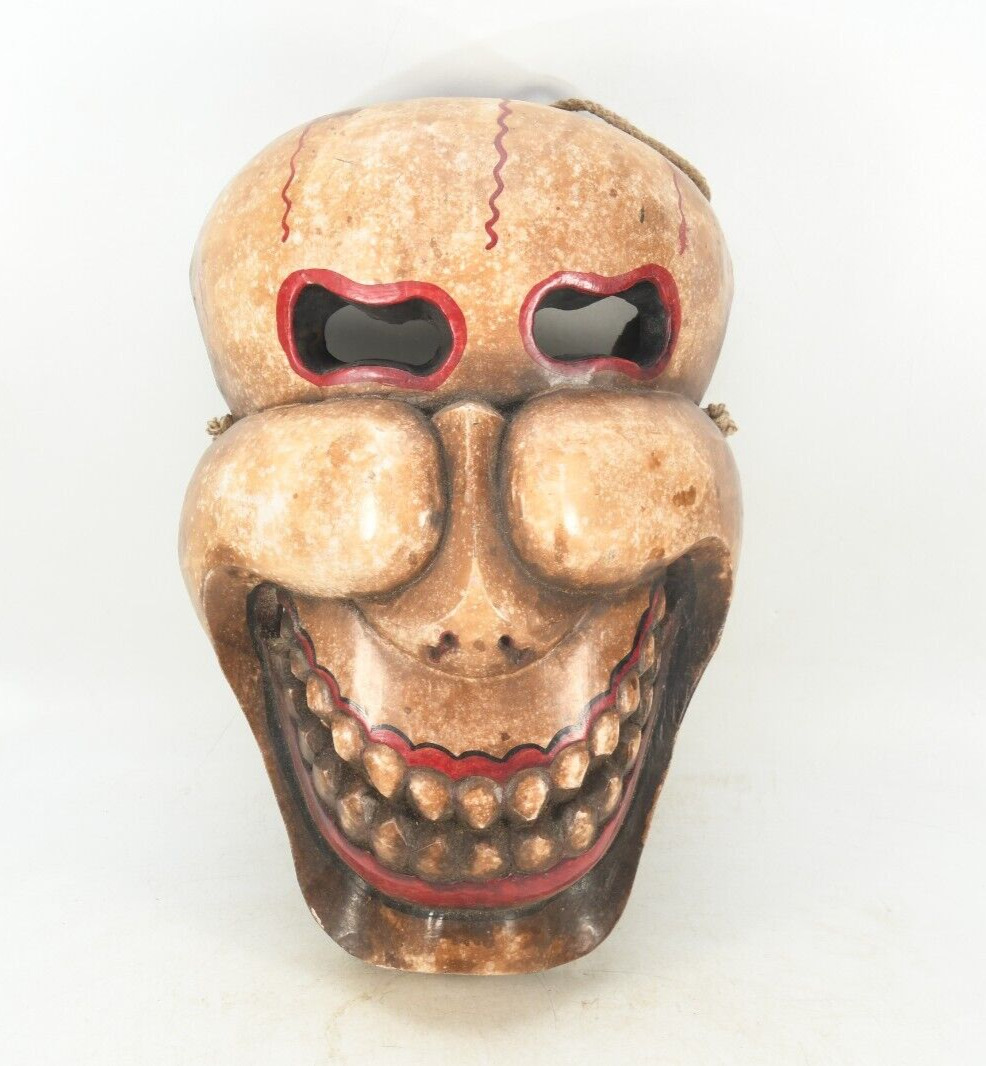 Enigmatic Echoes: Vintage Handcrafted Wooden Laughing Skull Wall Mask Decoration