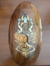 Picture of Saraswati goddess of Knowledge Creativity & Music made of wood. picture