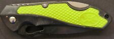 green and black pocket knife picture