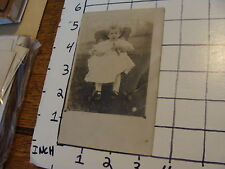 Vintage Early Photo: REAL PHOTO POST CARD BABY IN CHAIR WITH TOY BOAT picture