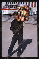 sl80  Original slide 1987  EuropeYoung man holding stack of Pretzels  066a picture