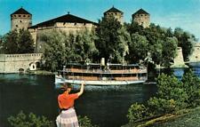 SAVOLINNA, Finland   OLAVINLINNA CASTLE  Woman Waving At Tour Boat   Postcard picture