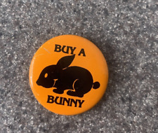 Vintage Buy A Bunny Metal Pin Pinback Button Heifer Project Orange & Black ~ 1