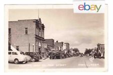 c1940 RPPC ONEILL NEBRASKA DOWNTOWN BAKERY CAR SCHMIDTS BEER VINTAGE POSTCARD NE picture