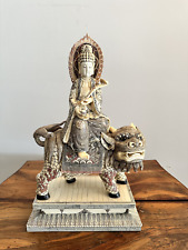 Carved Sculpture of Sitting Buddha on a Dragon picture