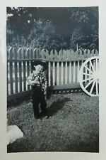CUTE BOY IN COWBOY COSTUME IN BACKYARD PICKET FENCE IS SLICE OF AMERICANA picture