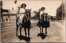 1910s RPPC Real Photo Postcard Two Young Ladies on Horses / Street Scene picture
