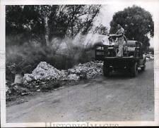 1947 Press Photo Truck sprays on rubbish to combat spread of Infantile Paralysis picture