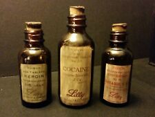 Vintage Style Lilly Cannabis, Heroin & Cocaine Medicine Bottles.By Artist picture