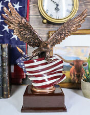 Patriotic Bald Eagle With Spread Out Wings Clutching On American Flag Statue picture