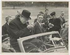 July 1945 press photo of Winston Churchill lighting a cigar on the hustings picture