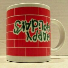 Upside Down Happy Holidays on Red Brick Background Holiday Mug Houston Foods picture