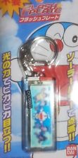 Doraemon Keychain Flash Plate from Japan, new in package from 2006 Very rare picture