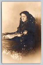 RPPC Woman In Stylish Fancy Floral Dress Sits & Reads CLASSIC Chair VTG Postcard picture