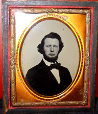 1/9th size Ruby Ambrotype of young man in half case picture