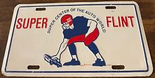 Super Center Auto World Booster License Plate Flint Michigan Football XVI picture