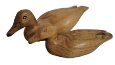 Pair of ducks carved from wood. Love the carved details. Beautiful wood grain picture