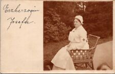 Real Photo Postcard Red Cross Nurse Sitting in Wicker Chair picture