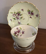 Heathcote Bone China Green Teacup Trimmed In Gold And Saucer With Purple Flowers picture