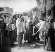 Egyptian street vendor selling tea to passers- by 1910 in Egypt Old Photo picture