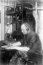 Man is in charge of the wireless communications on board a firefig - Old Photo picture