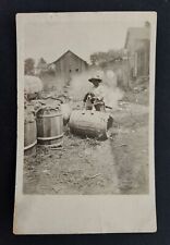 antique RPPC PHOTOGRAPH poverty CHILD DOG on BARREL homes clothes line post card picture