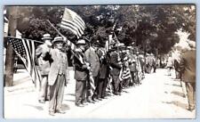 RPPC VETERANS PARADE ROUTE WAVING AMERICAN FLAGS PATRIOTIC POSTCARD**TRIMMED** picture