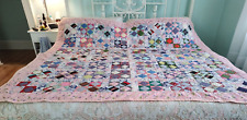 Beautiful, classic four patch quilt, made from pastel colores solid pink68” X 80 picture