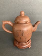 Peculiar purple clay teapot with animal handle and spout picture