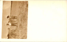 Two Farmers with Hay Sepia RPPC Postcard Unposted Location Unknown picture