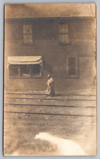 RPPC Woman Walking on Railroad Tracks and Building Elkhorn WI Postcard picture
