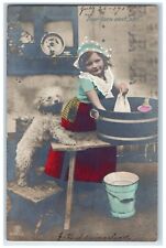 1908 Little Girl Doing Laundry Cute Dog RPPC Photo Posted Antique Postcard picture