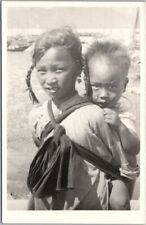 Vintage Asia Real Photo Postcard Girl with Baby on Back / Location Unknown picture