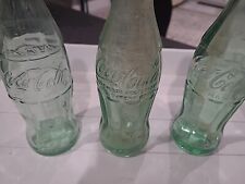 Three Vintage Coca-Cola Bottles picture