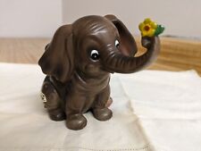 Vtg. Josef Originals brown elephant holding flower figurine picture