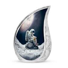 Discover the 'Astronaut Suit Sitting on Cracked Stone' - Unique Urns For Adults picture