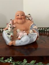 Laughing Buddha with children, fertility symbol picture