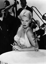 Kim Novak sexy pose huge cleavage holding cigarette seated 5x7 inch press photo picture