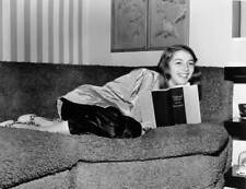 Italian-born actress Pier Angeli reads a copy of the book 'Nati - 1950 Old Photo picture