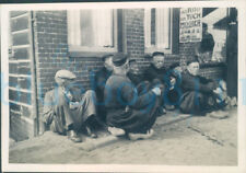 1956 Girl Guides photo  cycle trip to Holland Old men sat on pavement picture